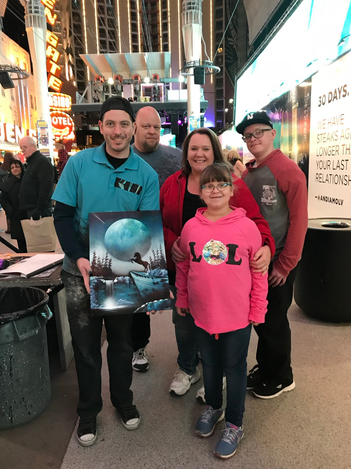 Family of happy collectors with an original spray painting