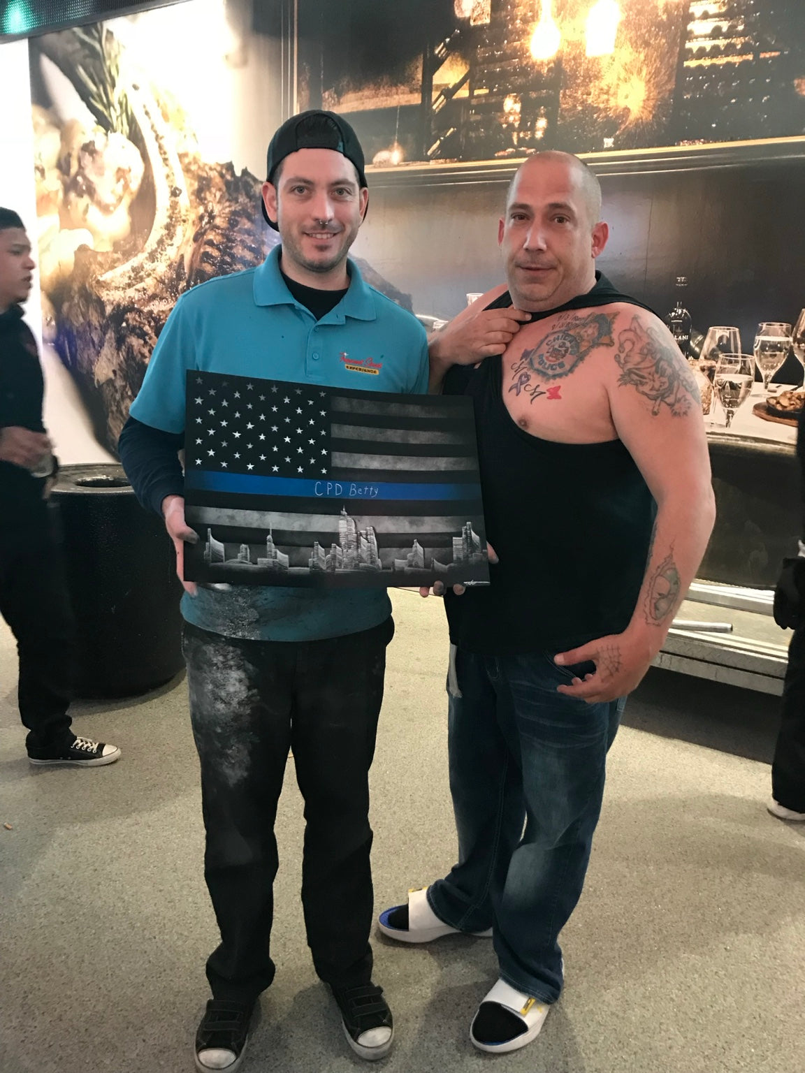 Happy collector with a custom thin blue line Las Vegas painting